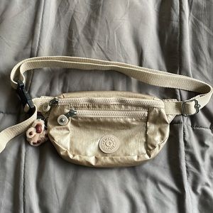 Kipling waist bag/fanny pack in metallic gold. BRAND NEW